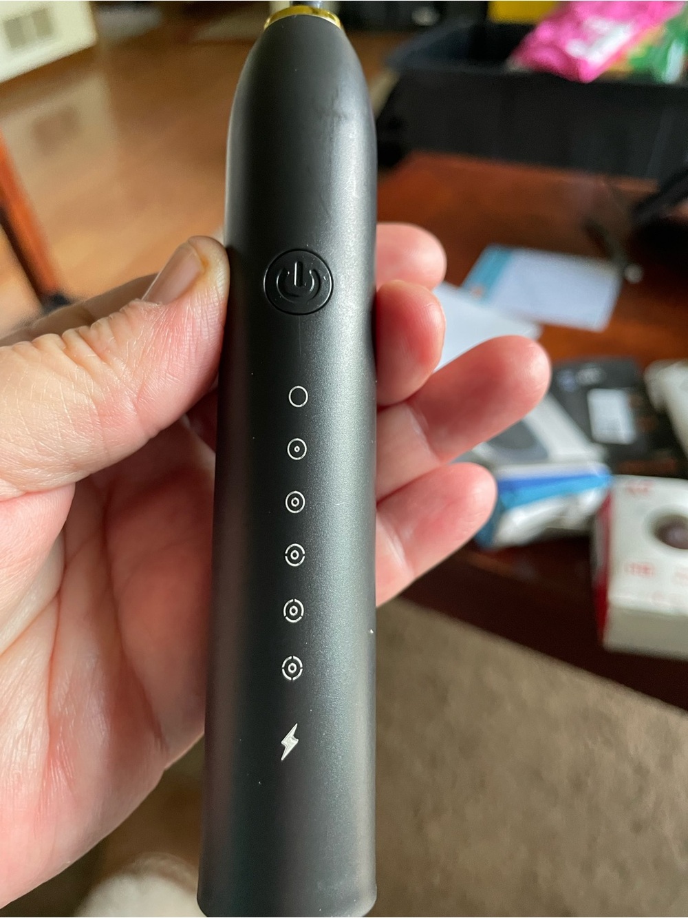 Black Electric Oral Care Device with LED Indicators